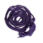 A purple braided cord coiled in a pile with two tassels on each end.